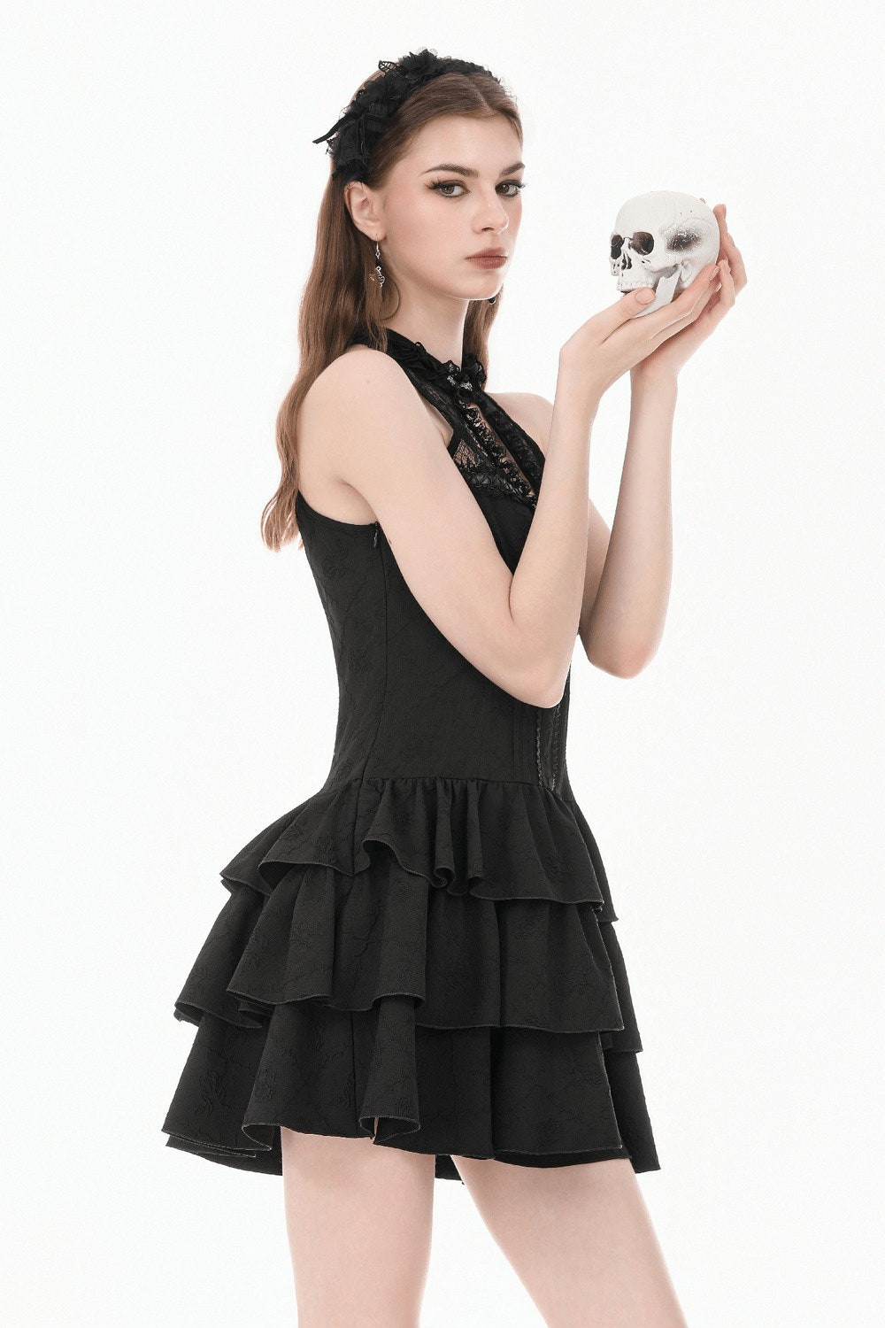 Black Gothic Halter Mini Dress with Tiered Ruffles worn by model holding a skull, showcasing a dramatic lace design.