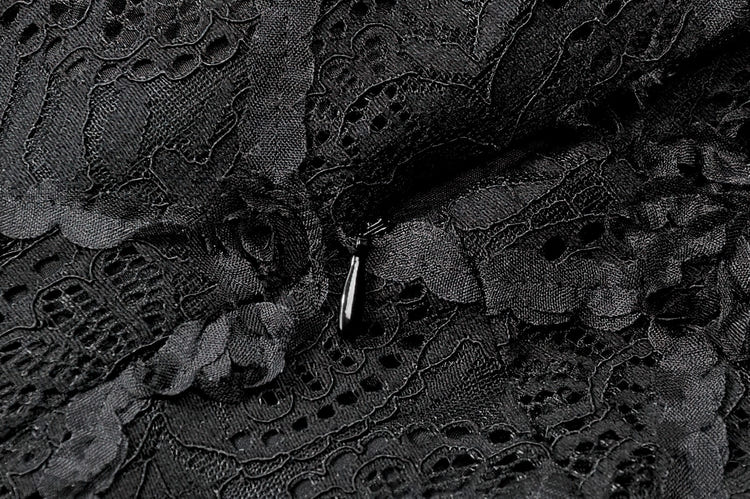Dark Romantic Lace Mini Dress with Corset Waist and Cross detailed lace fabric close-up.