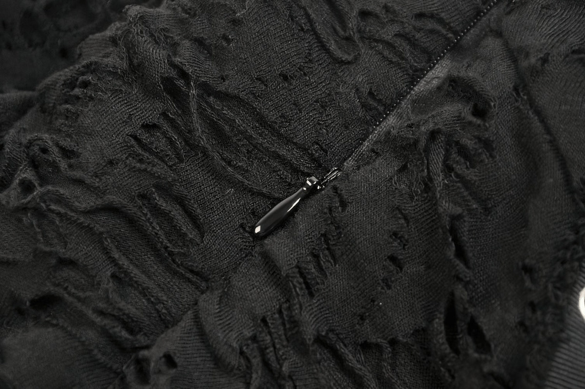 Close-up of the distressed texture and zipper detail.