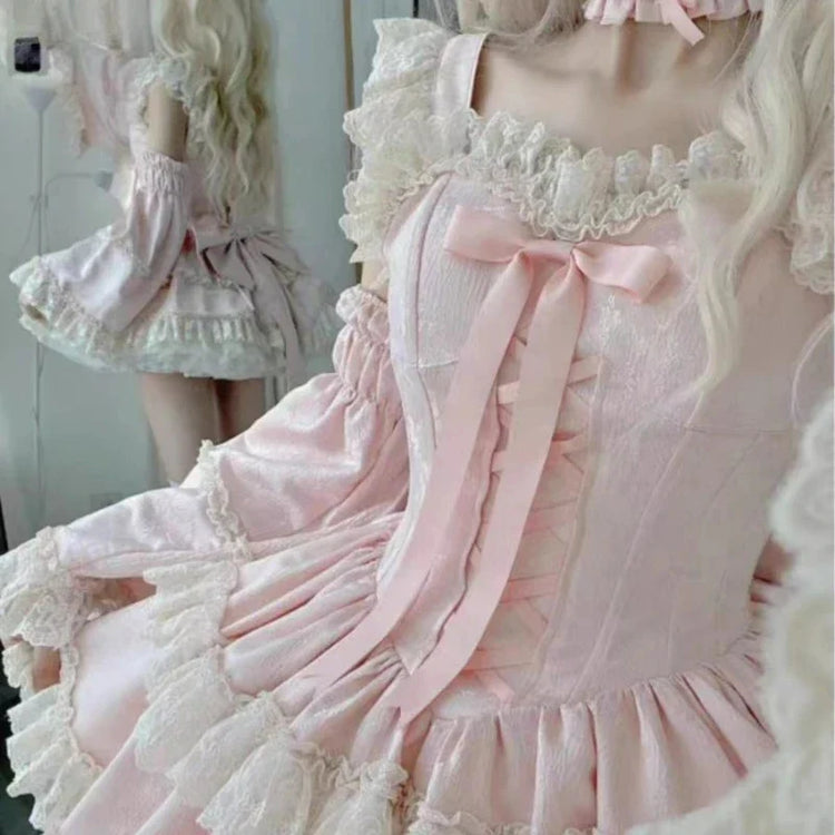 Pink dress lace neckline and ribbon tails detail