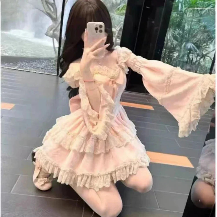 Pink lace dress and detachable flared sleeves seated view