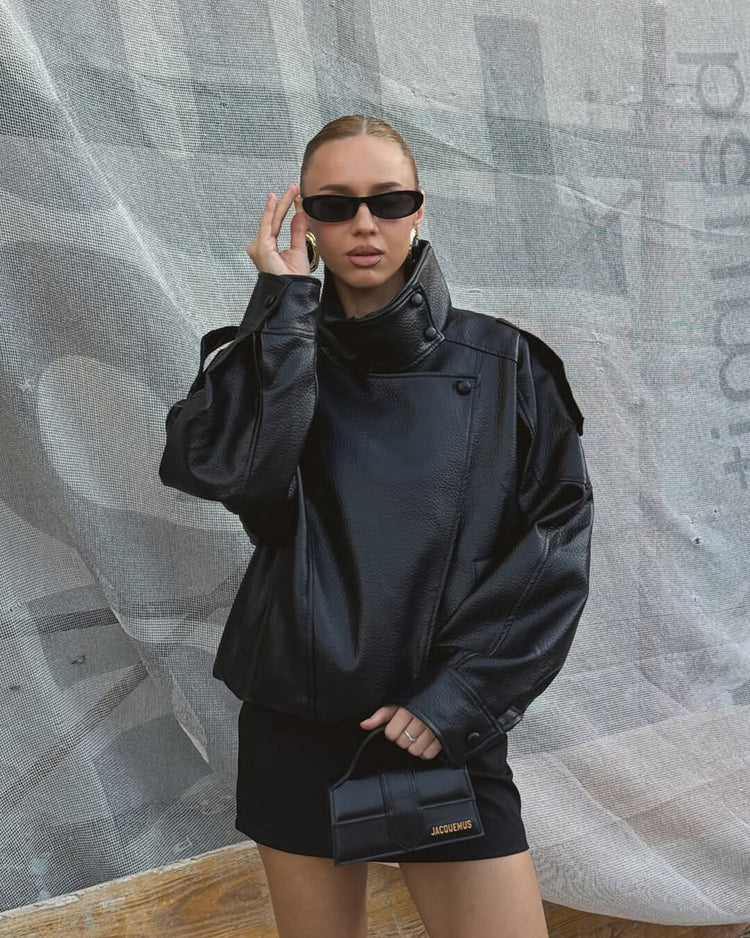 Black asymmetrical vegan leather jacket styled view
