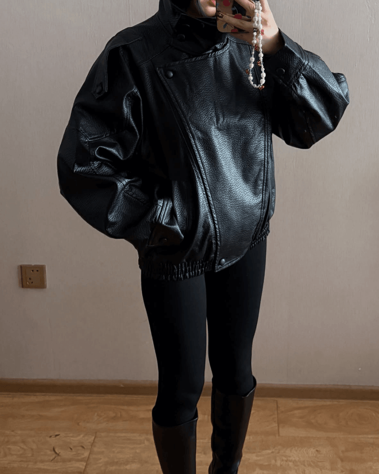 Black long-sleeve vegan leather jacket detail
