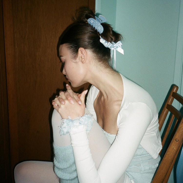 Model wearing Sweetheart Clip in Blue Ribbon