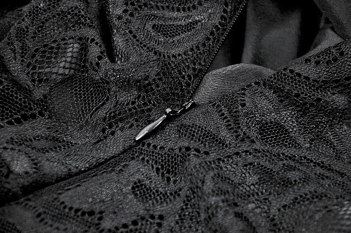 Victorian Goth Tiered Midi Dress With Sheer Floral Skirt detailed black lace close-up showcasing the intricate fabric texture.