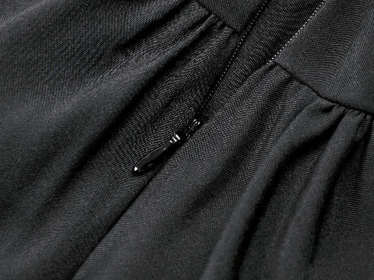 Close-up of the zipper detail on the Women's Gothic Cold Shoulder Mini Dress with Lace Sleeves, showcasing luxurious black fabric.