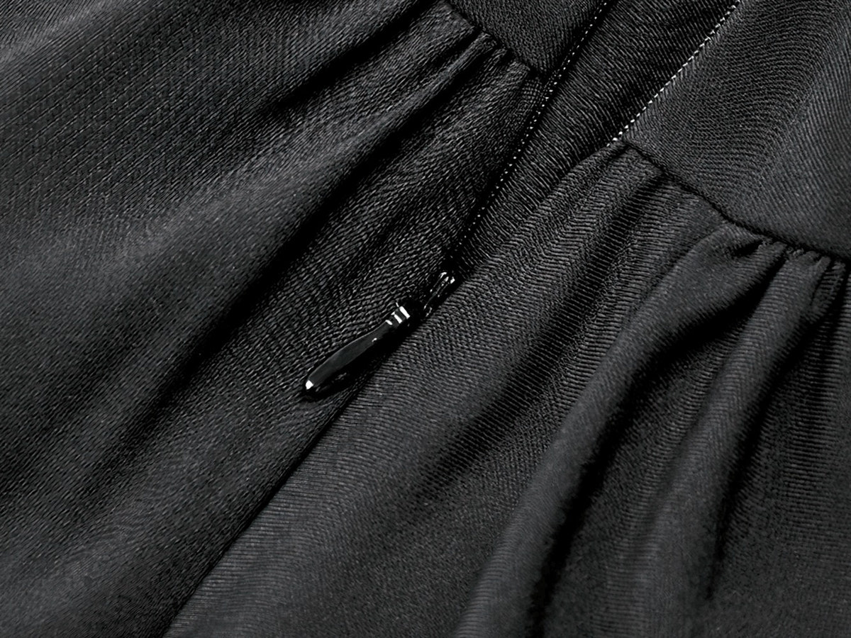 Close-up of the zipper detail on the Women's Gothic Cold Shoulder Mini Dress with Lace Sleeves, showcasing luxurious black fabric.